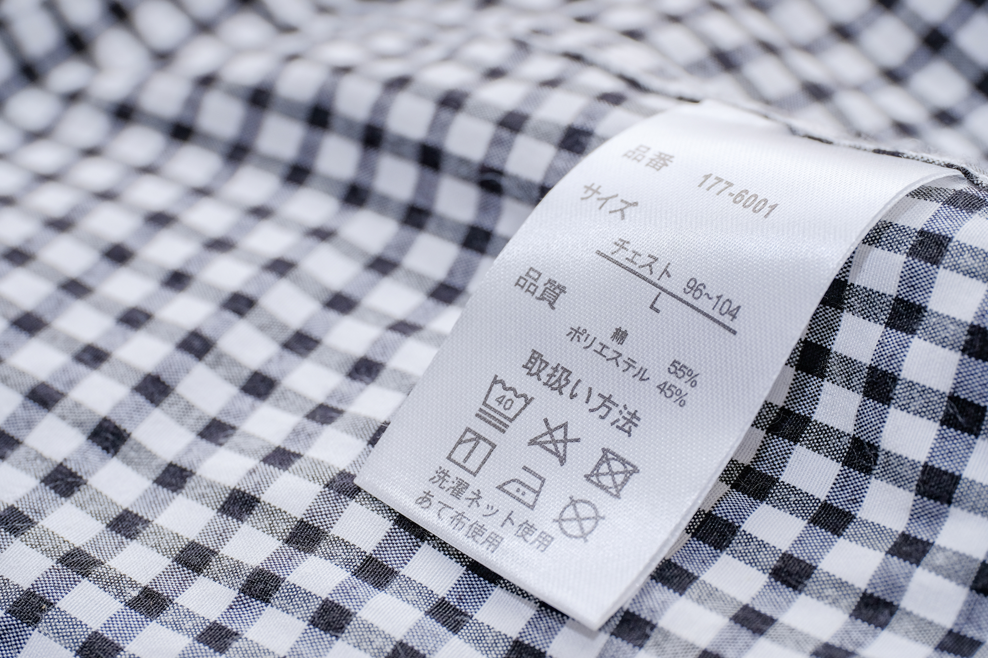 アパレル品質表示の完全ガイド｜組成・洗濯・原産国の法的ルールと検品ポイント